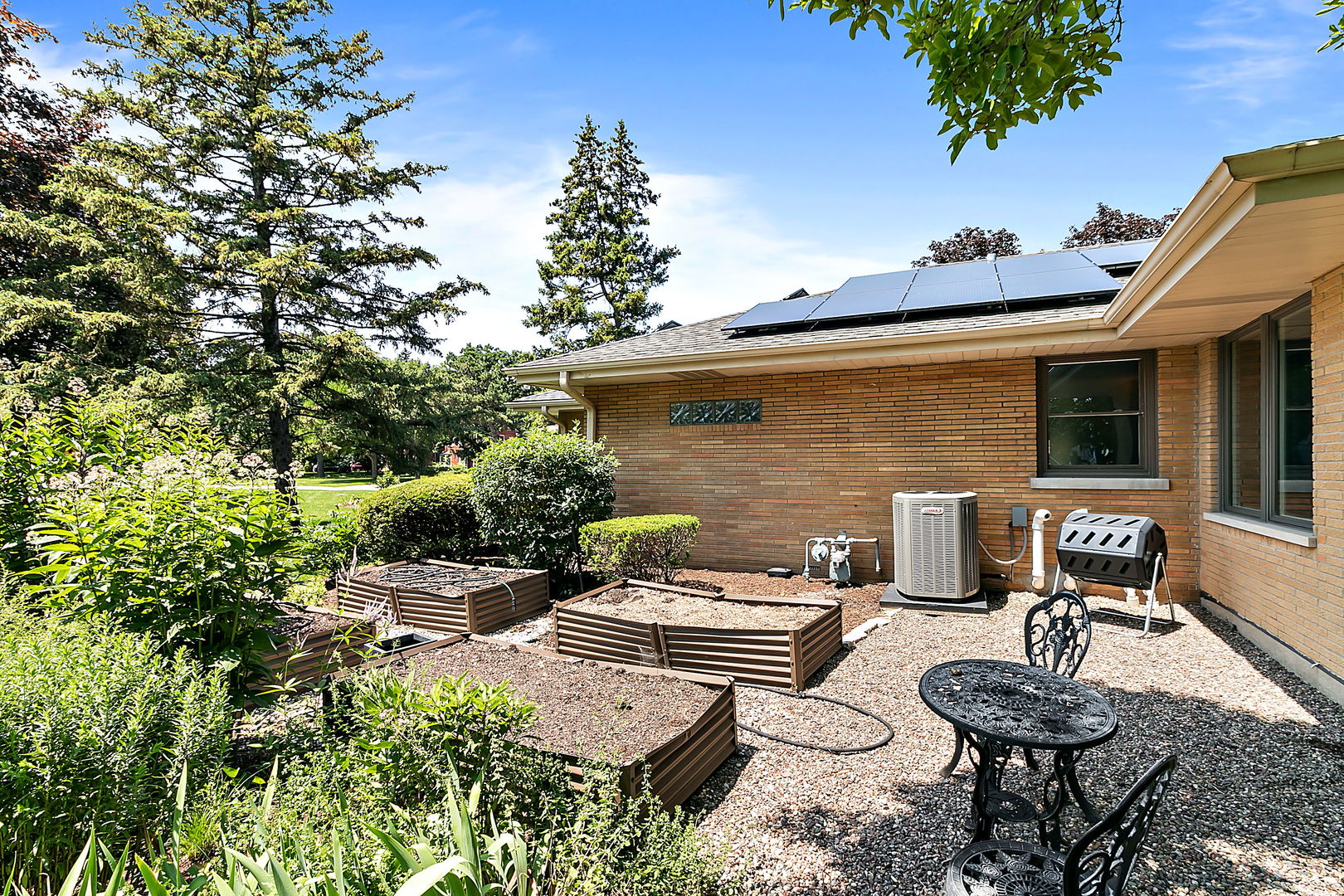 379 Audubon Road Riverside, IL 60546 - Photo 28 of 37 a backyard of a house with fire pit and outdoor seating