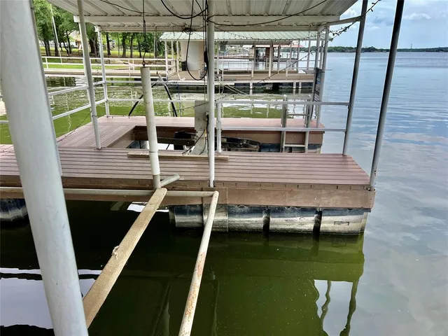 a view of swimming pool with a table and chairs