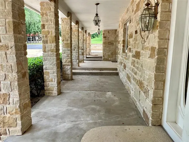 a view of entryway with wooden floor and windows