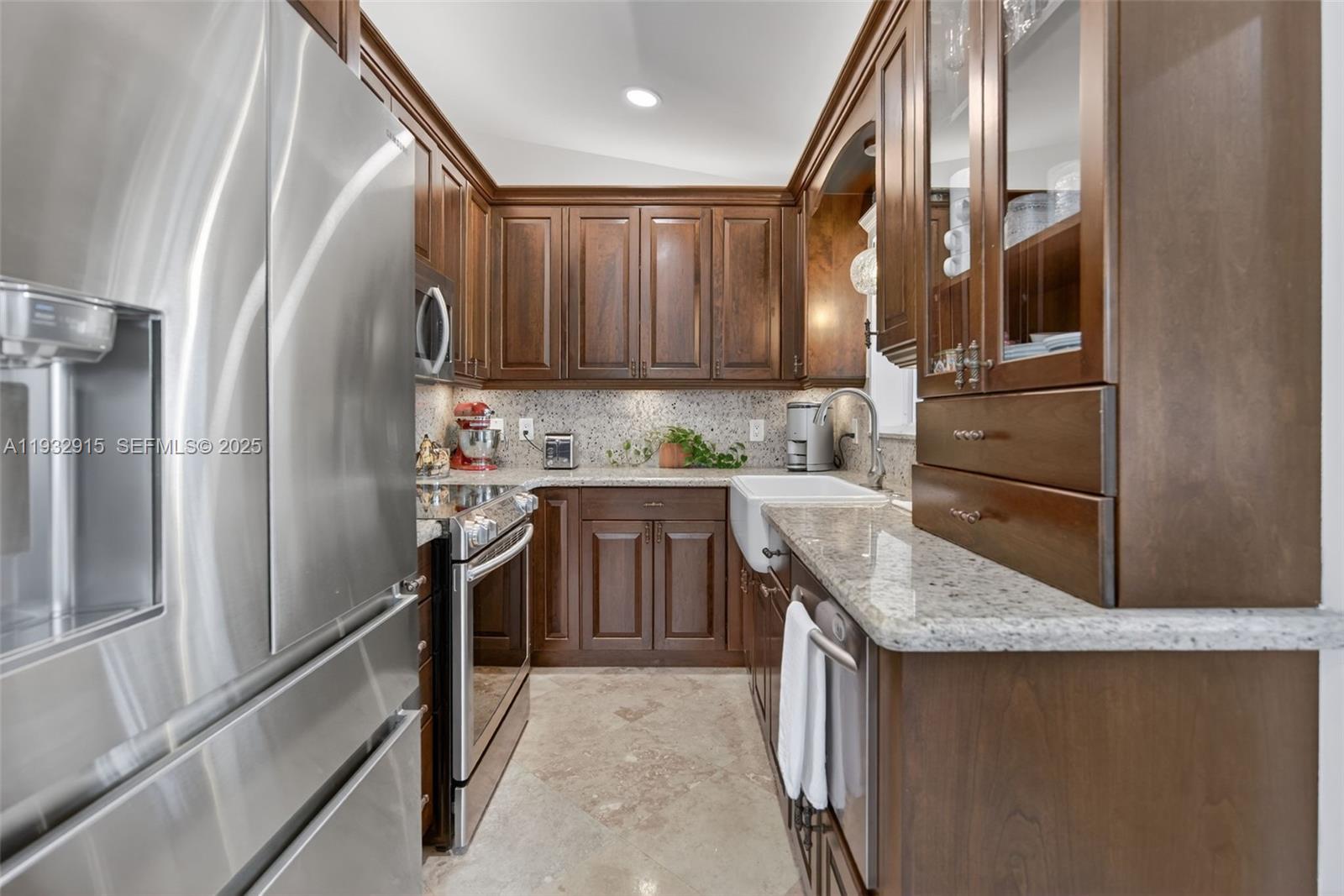 11260 Southwest 48th Street Miami, FL 33165 - Photo 11 of 48 a kitchen with granite countertop a refrigerator stove and sink