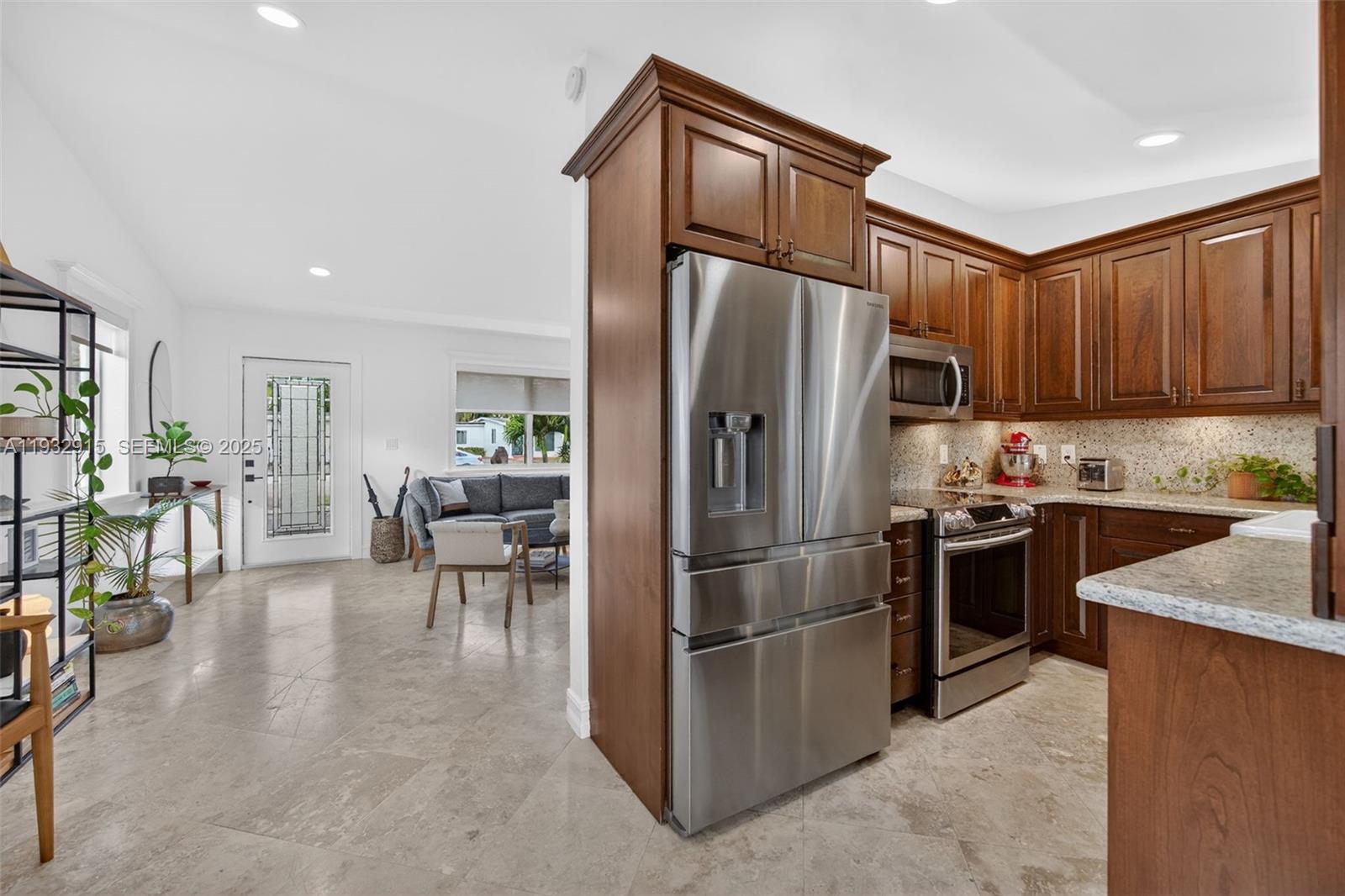 11260 Southwest 48th Street Miami, FL 33165 - Photo 14 of 48 a kitchen with stainless steel appliances granite countertop a refrigerator stove and a sink