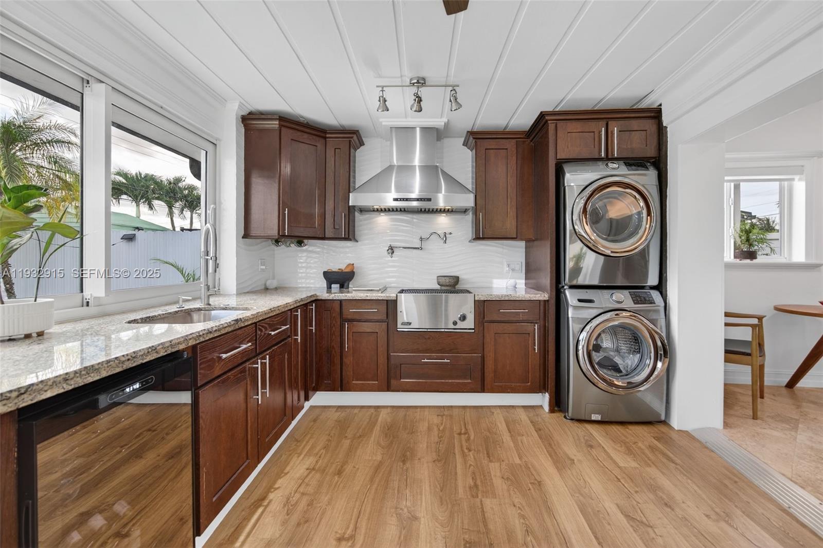 11260 Southwest 48th Street Miami, FL 33165 - Photo 16 of 48 a large kitchen with stainless steel appliances granite countertop a stove and a wooden floors