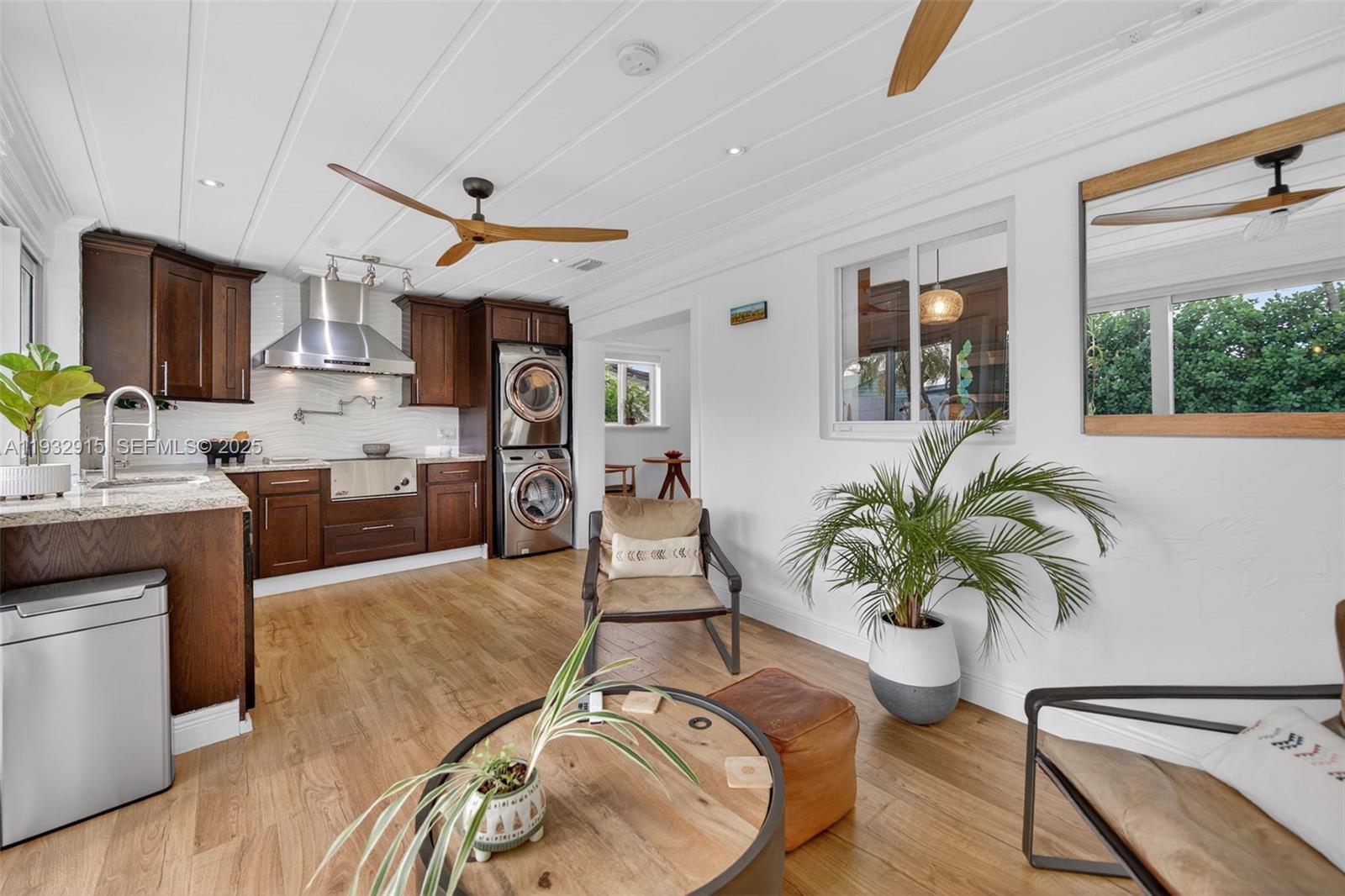 11260 Southwest 48th Street Miami, FL 33165 - Photo 18 of 48 a living room with furniture kitchen view and a large window