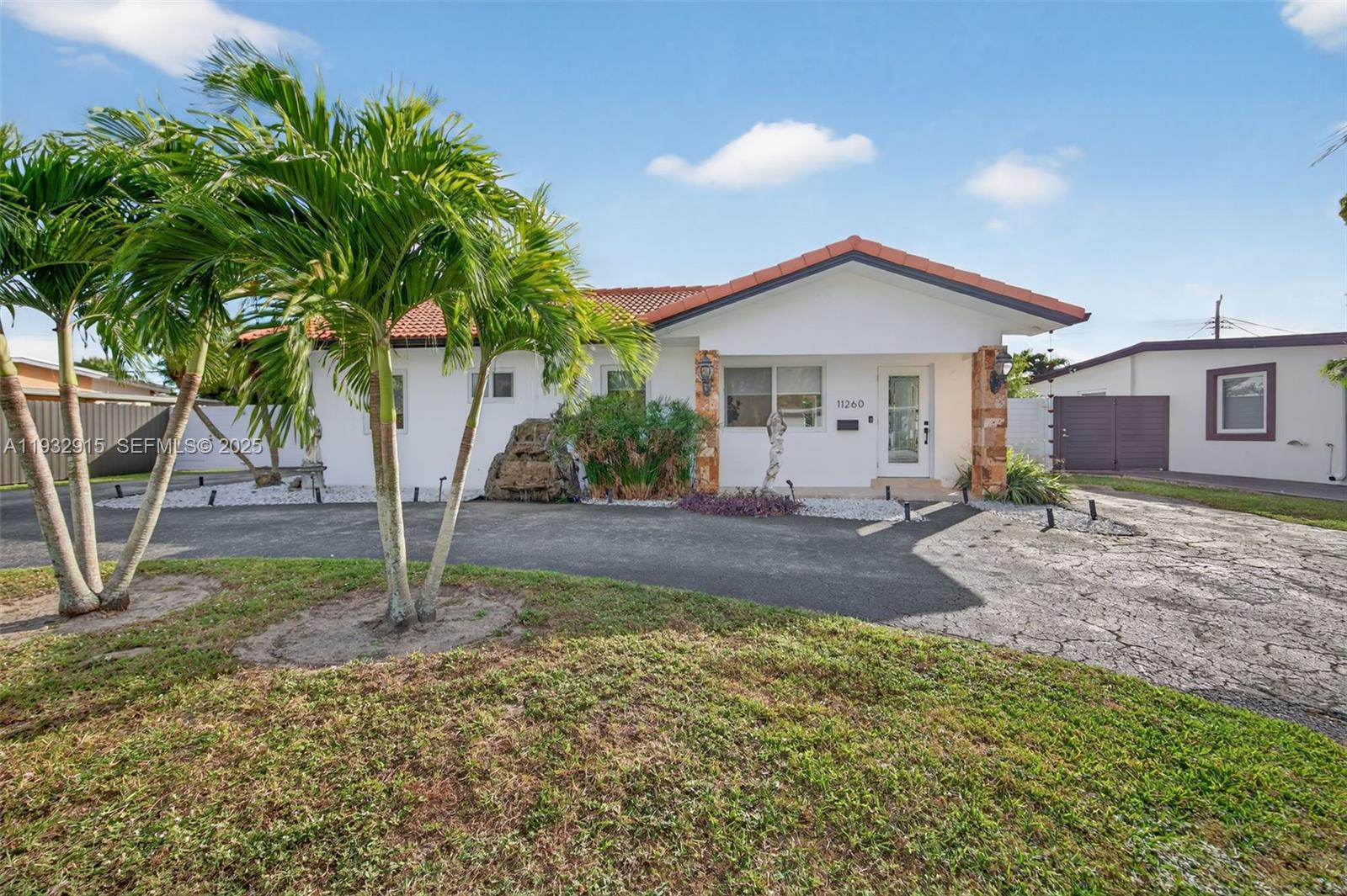 11260 Southwest 48th Street Miami, FL 33165 - Photo 2 of 48 a front view of a house with garden
