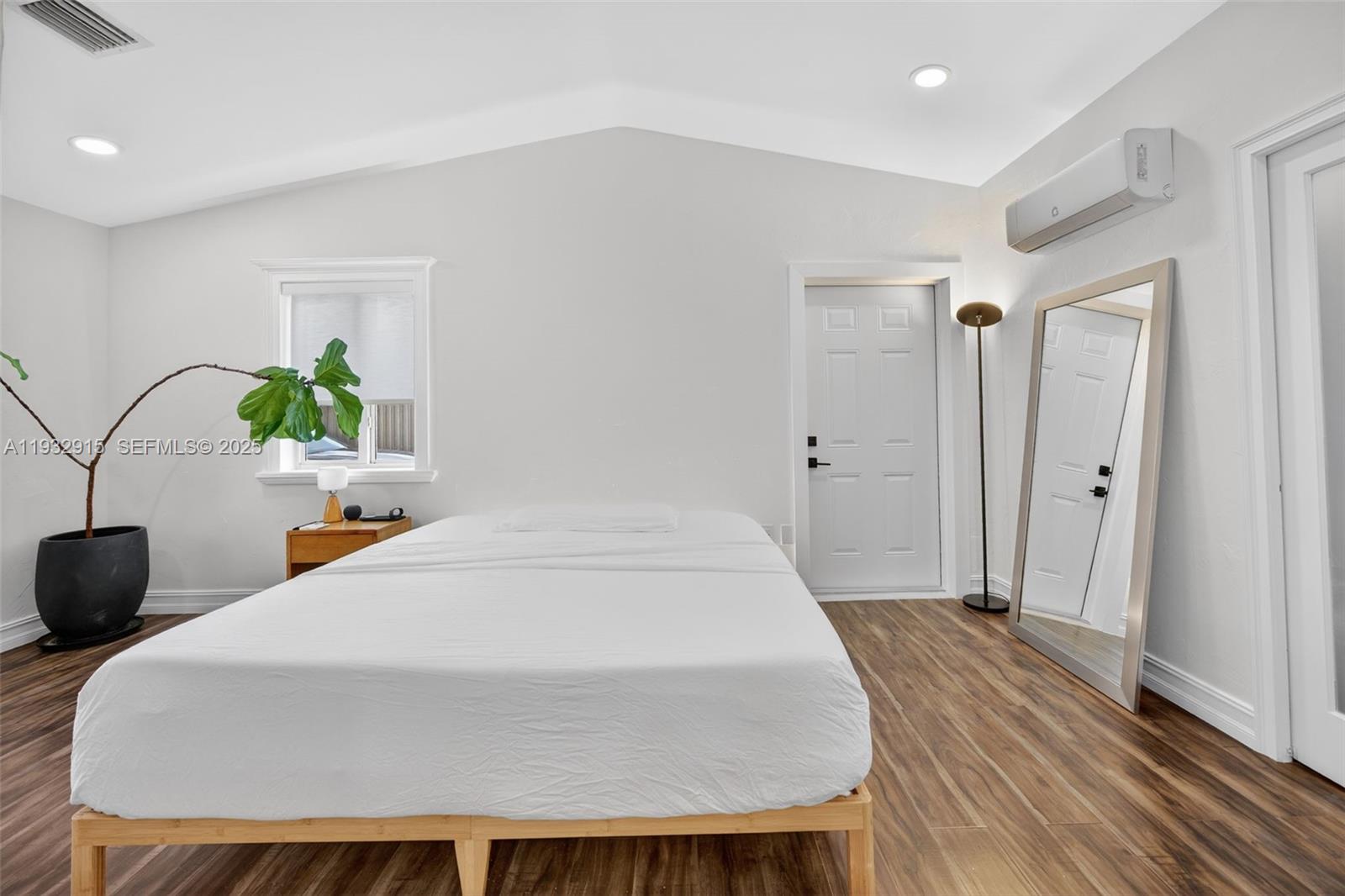 11260 Southwest 48th Street Miami, FL 33165 - Photo 21 of 48 a bedroom with a bed and a potted plant