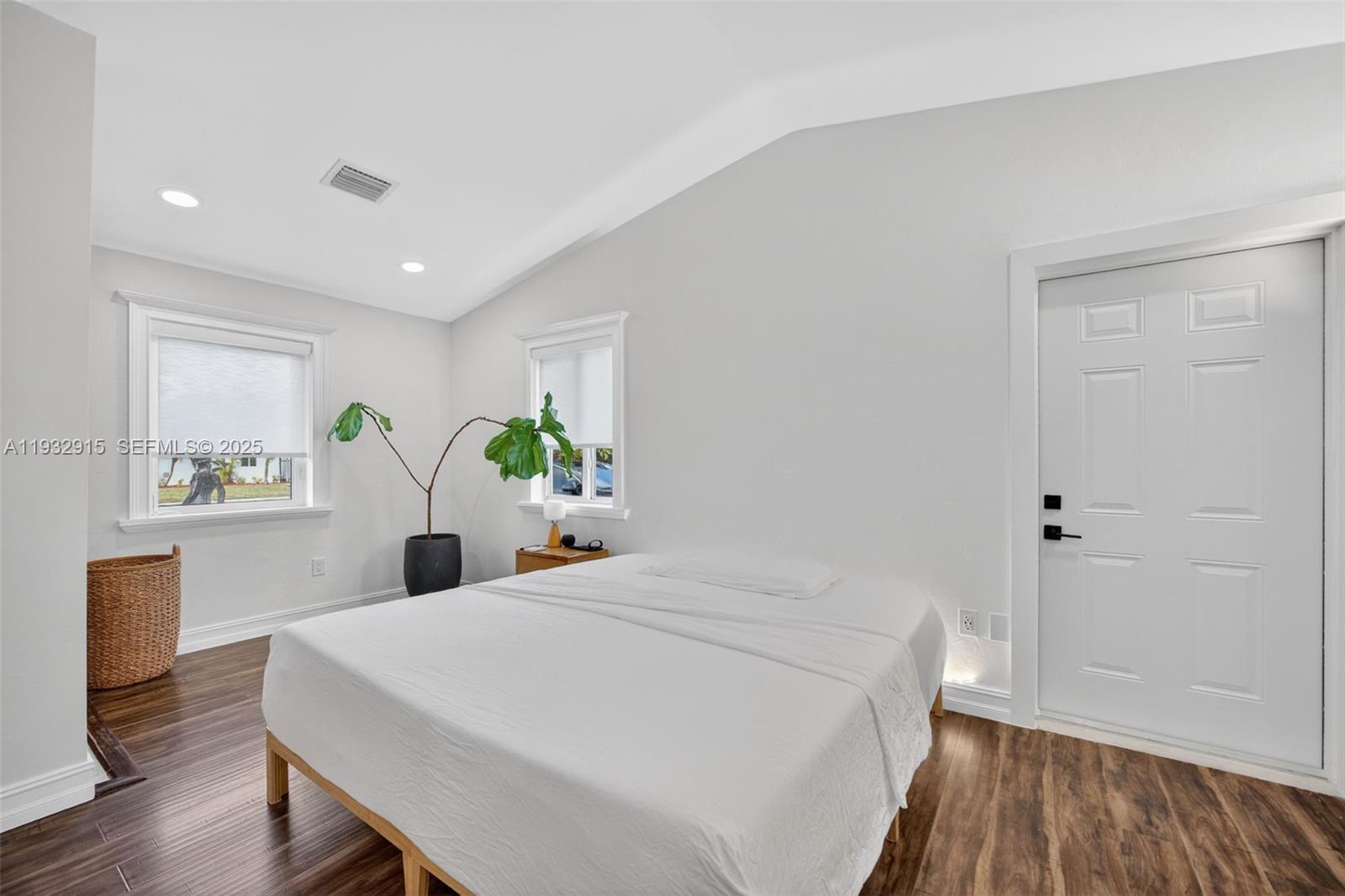 11260 Southwest 48th Street Miami, FL 33165 - Photo 22 of 48 a bed sitting in a spacious bedroom next to a window