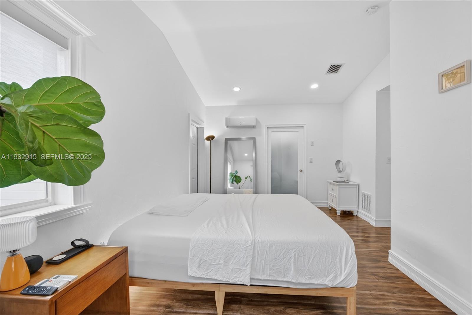 11260 Southwest 48th Street Miami, FL 33165 - Photo 23 of 48 a bedroom with a bed and a window