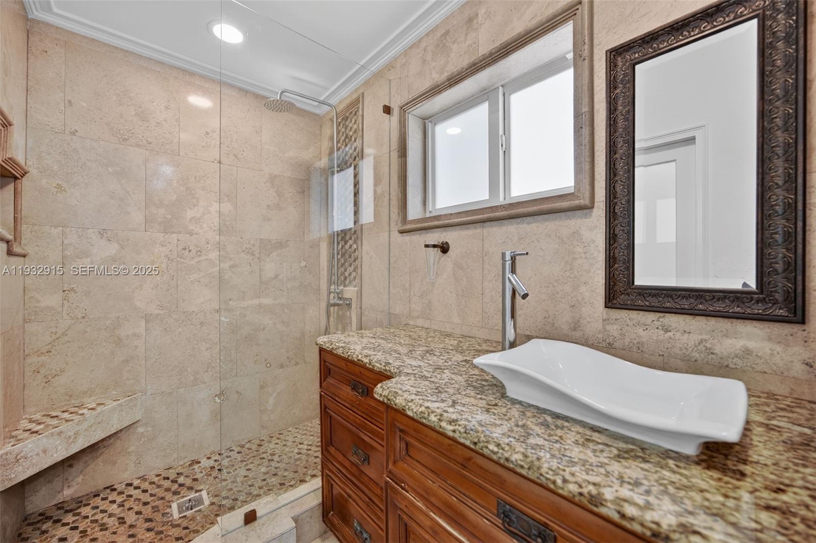 11260 Southwest 48th Street Miami, FL 33165 - Photo 25 of 48 a bathroom with a granite countertop sink a mirror and shower