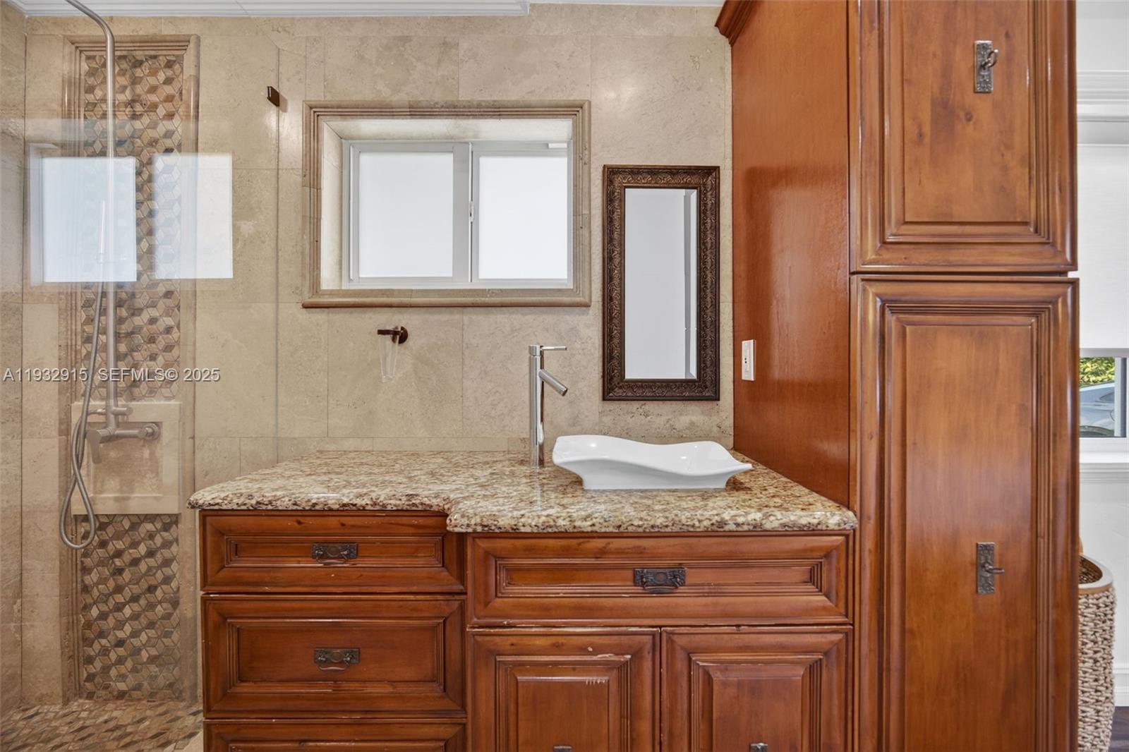 11260 Southwest 48th Street Miami, FL 33165 - Photo 27 of 48 a bathroom with a granite countertop sink and a mirror