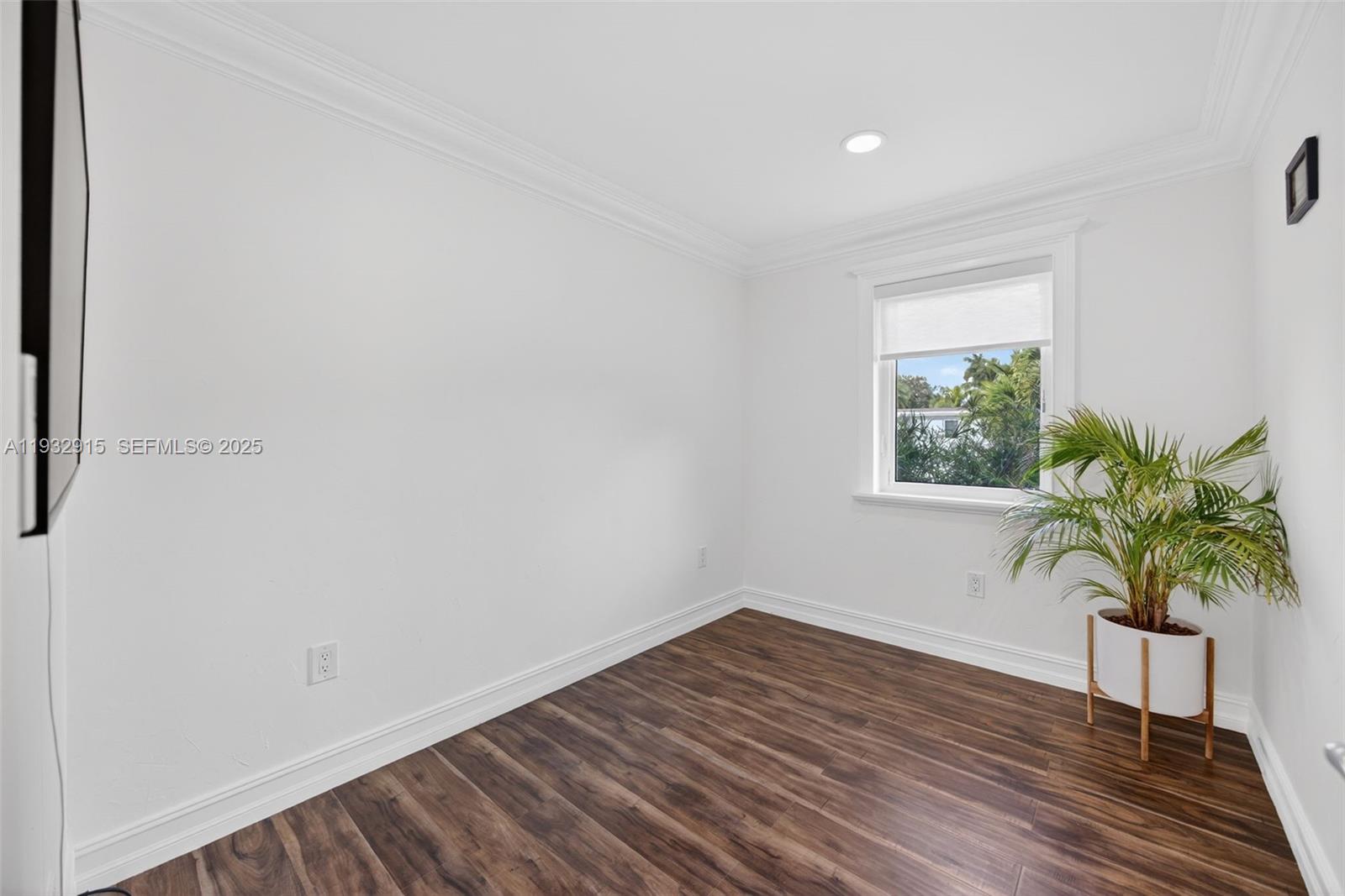 11260 Southwest 48th Street Miami, FL 33165 - Photo 28 of 48 a view of a room with wooden floor and potted plant