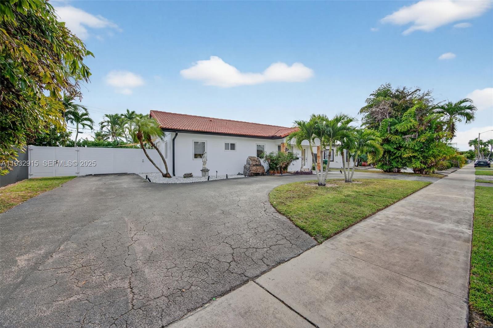 11260 Southwest 48th Street Miami, FL 33165 - Photo 3 of 48 a view of a house with a yard