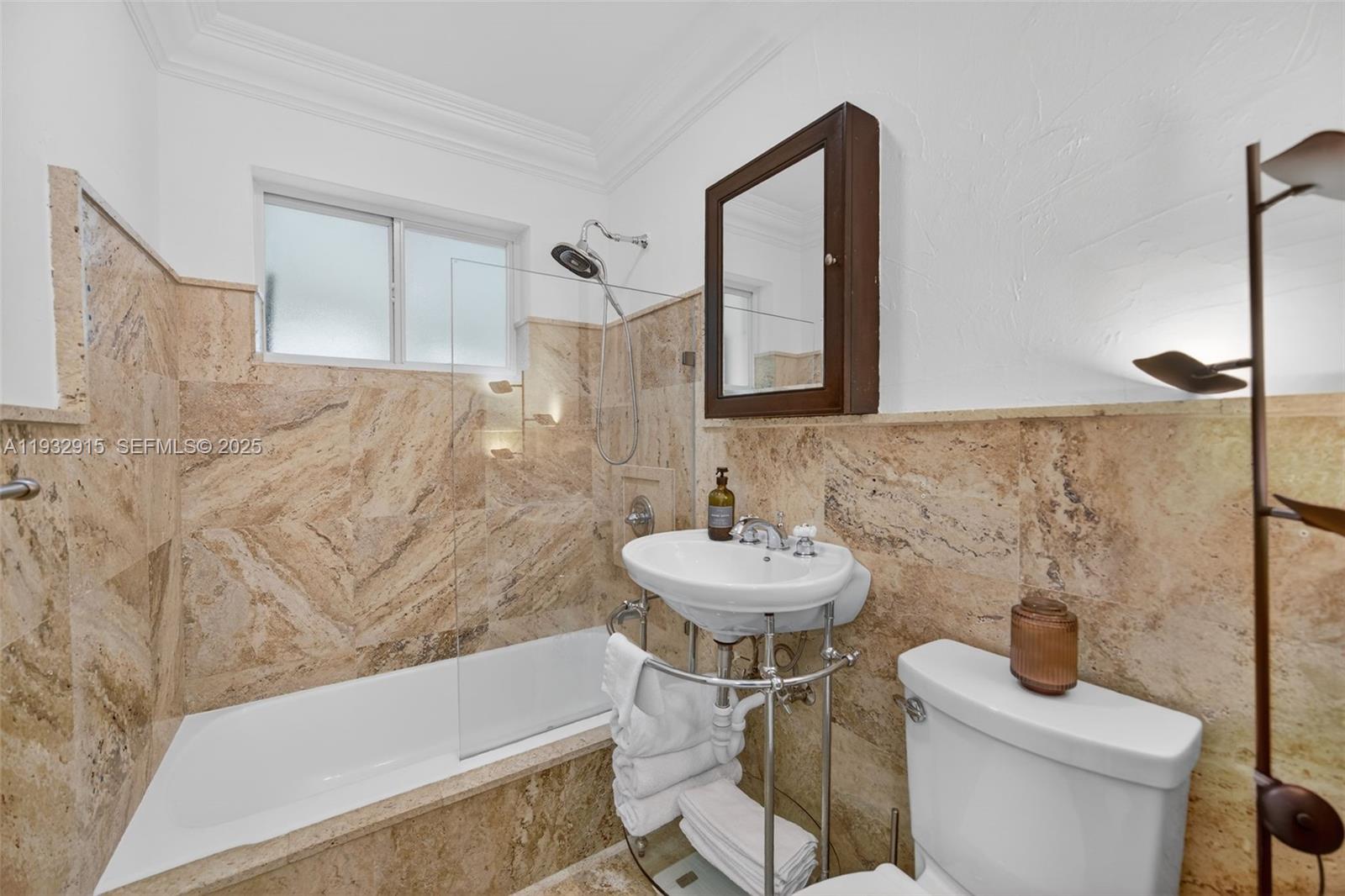 11260 Southwest 48th Street Miami, FL 33165 - Photo 31 of 48 a bathroom with a sink a toilet and a mirror