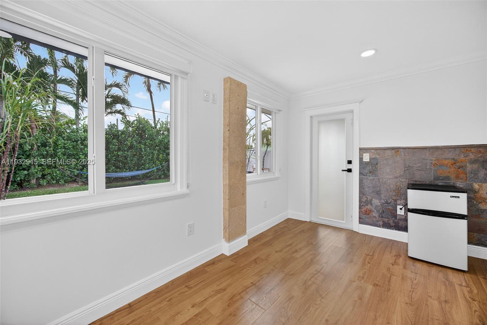 11260 Southwest 48th Street Miami, FL 33165 - Photo 36 of 48 wooden floor in an empty room with a window