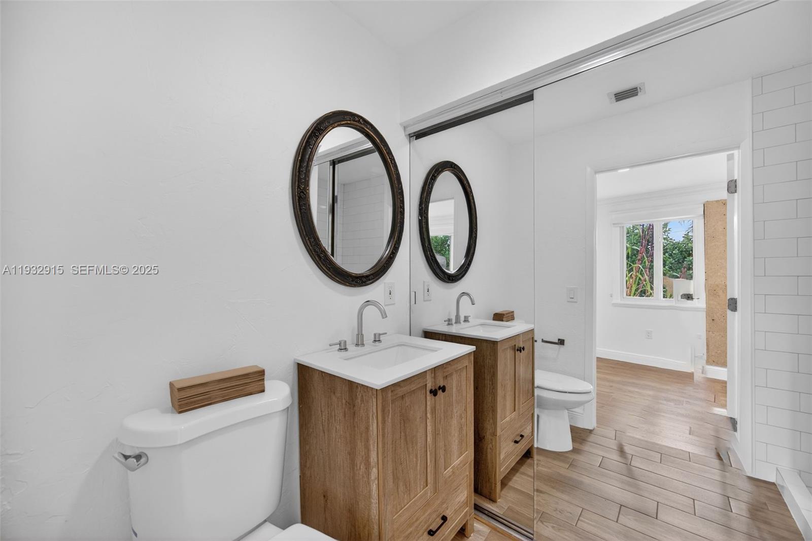 11260 Southwest 48th Street Miami, FL 33165 - Photo 37 of 48 a bathroom with a sink and a mirror