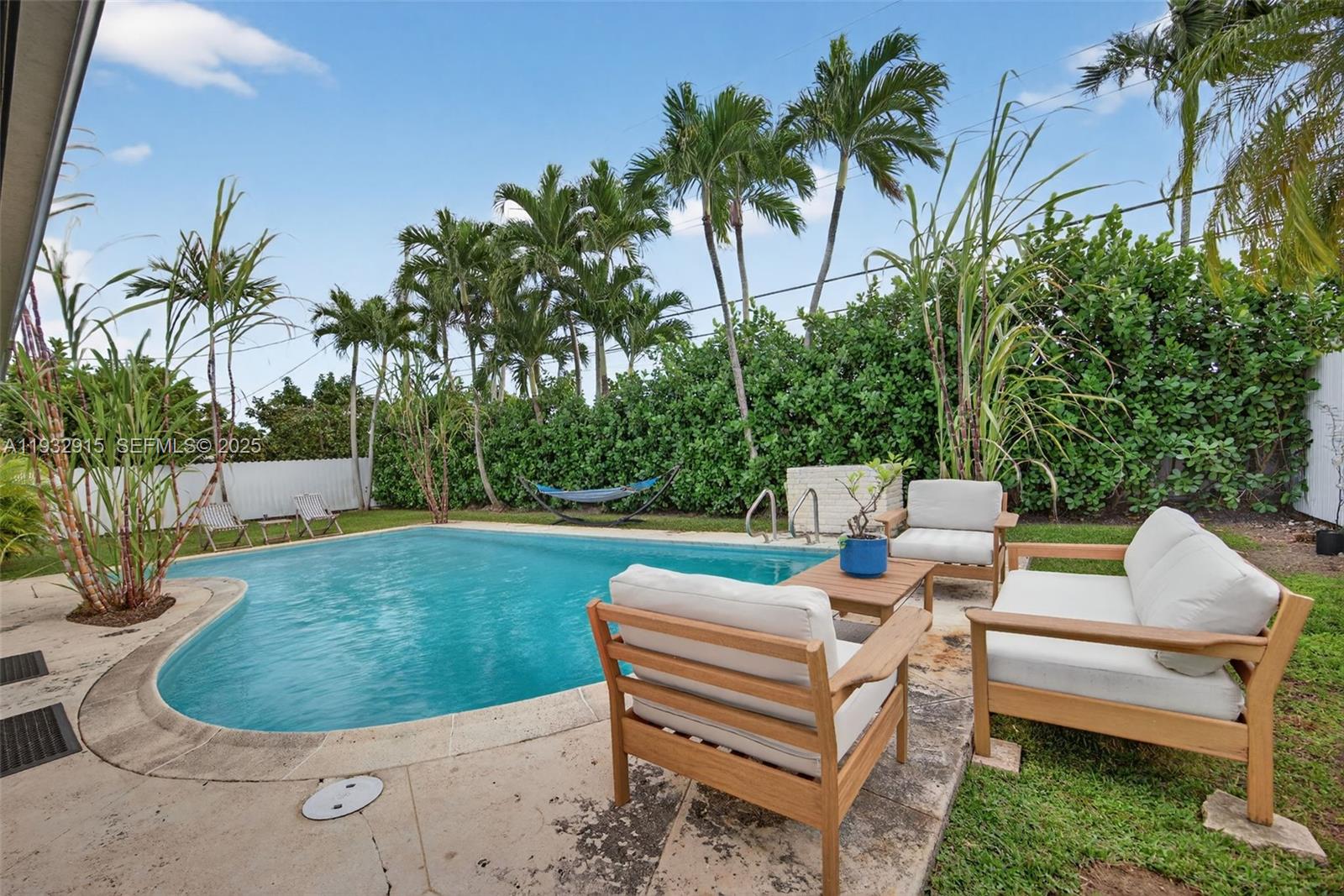 11260 Southwest 48th Street Miami, FL 33165 - Photo 46 of 48 a view of a lounge chair in the garden