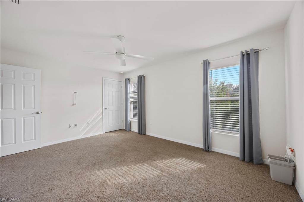 15071 Wildflower Circle Naples, FL 34119 - Photo 8 of 34 a view of an empty room with a window
