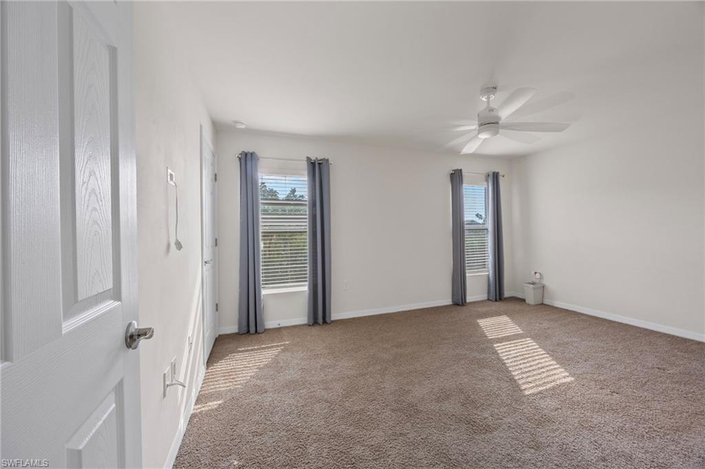 15071 Wildflower Circle Naples, FL 34119 - Photo 9 of 34 a view of an empty room with a bathroom