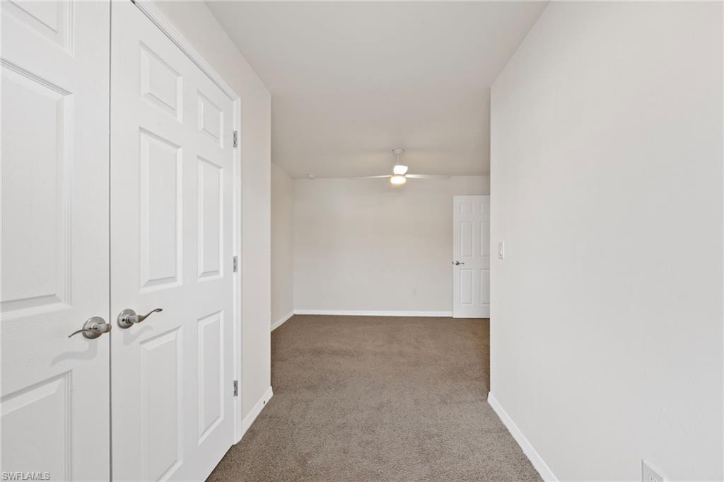 15071 Wildflower Circle Naples, FL 34119 - Photo 10 of 34 a view of a hallway