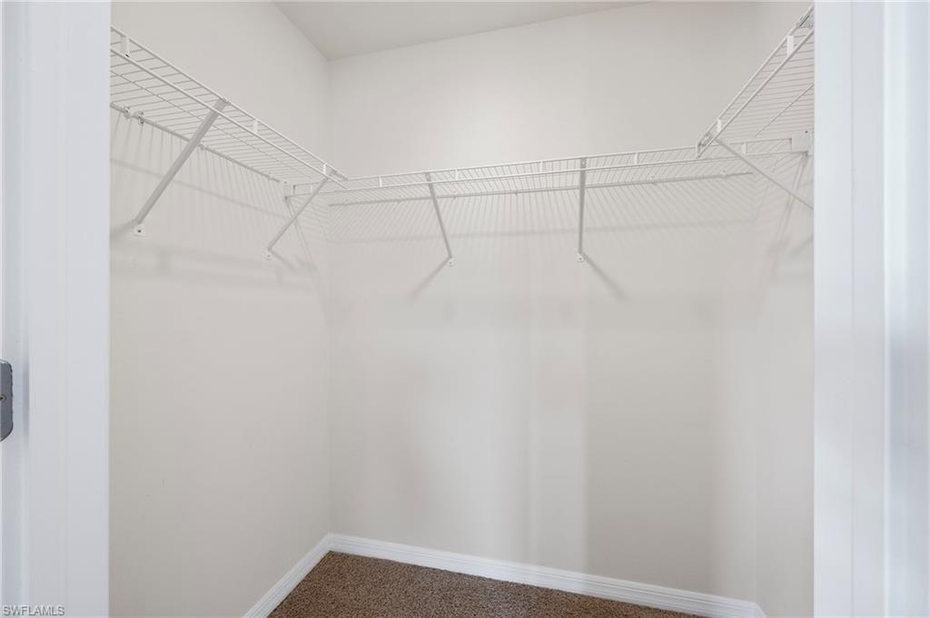 15071 Wildflower Circle Naples, FL 34119 - Photo 14 of 34 a view of a rack on the wall