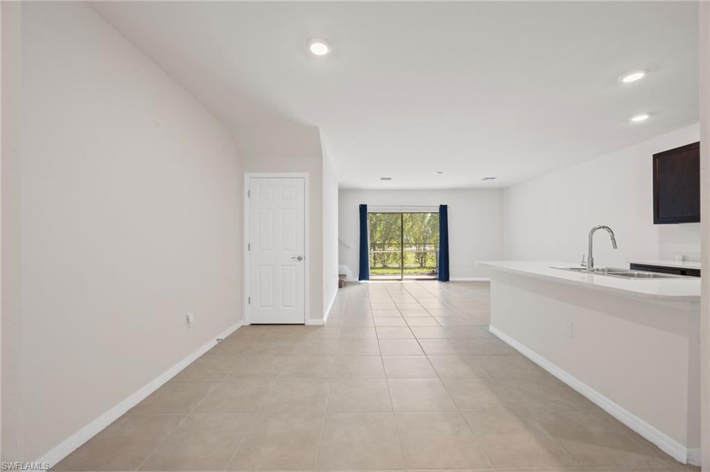 15071 Wildflower Circle Naples, FL 34119 - Photo 2 of 34 a view of a kitchen with a sink and a window
