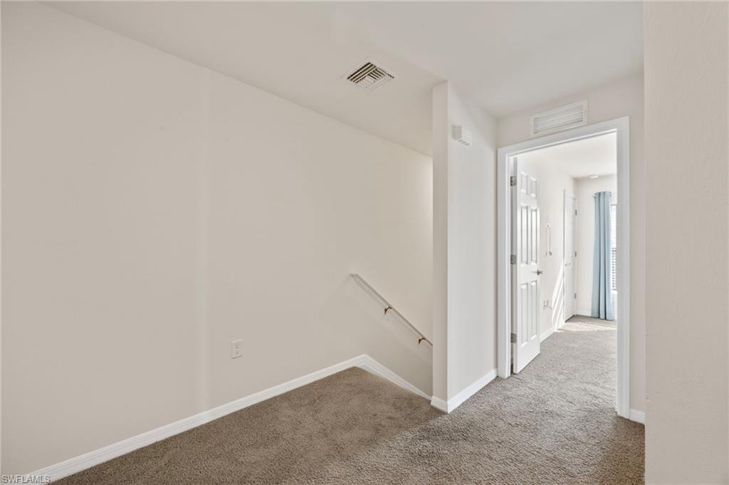 15071 Wildflower Circle Naples, FL 34119 - Photo 18 of 34 a view of an empty room