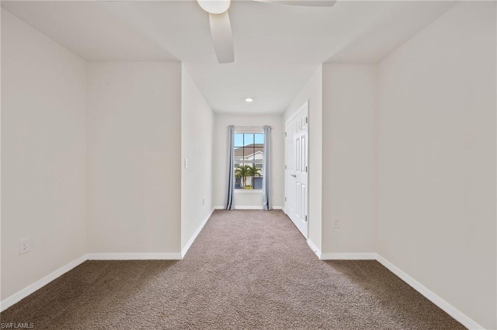 15071 Wildflower Circle Naples, FL 34119 - Photo 7 of 34 wooden floor in a hall with an entryway