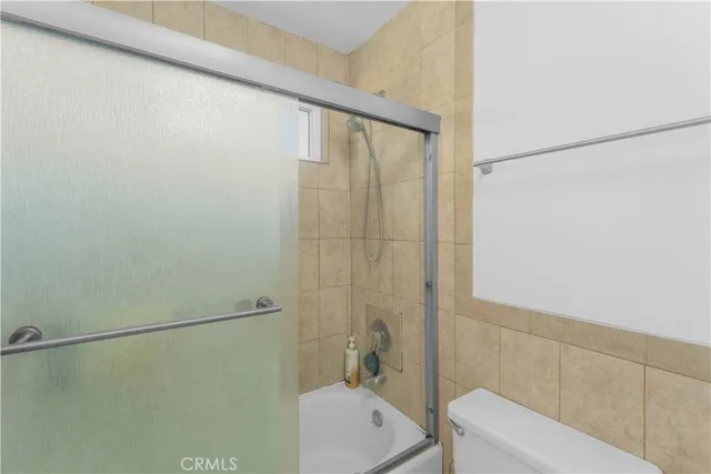 a bathroom with a white sink and a shower