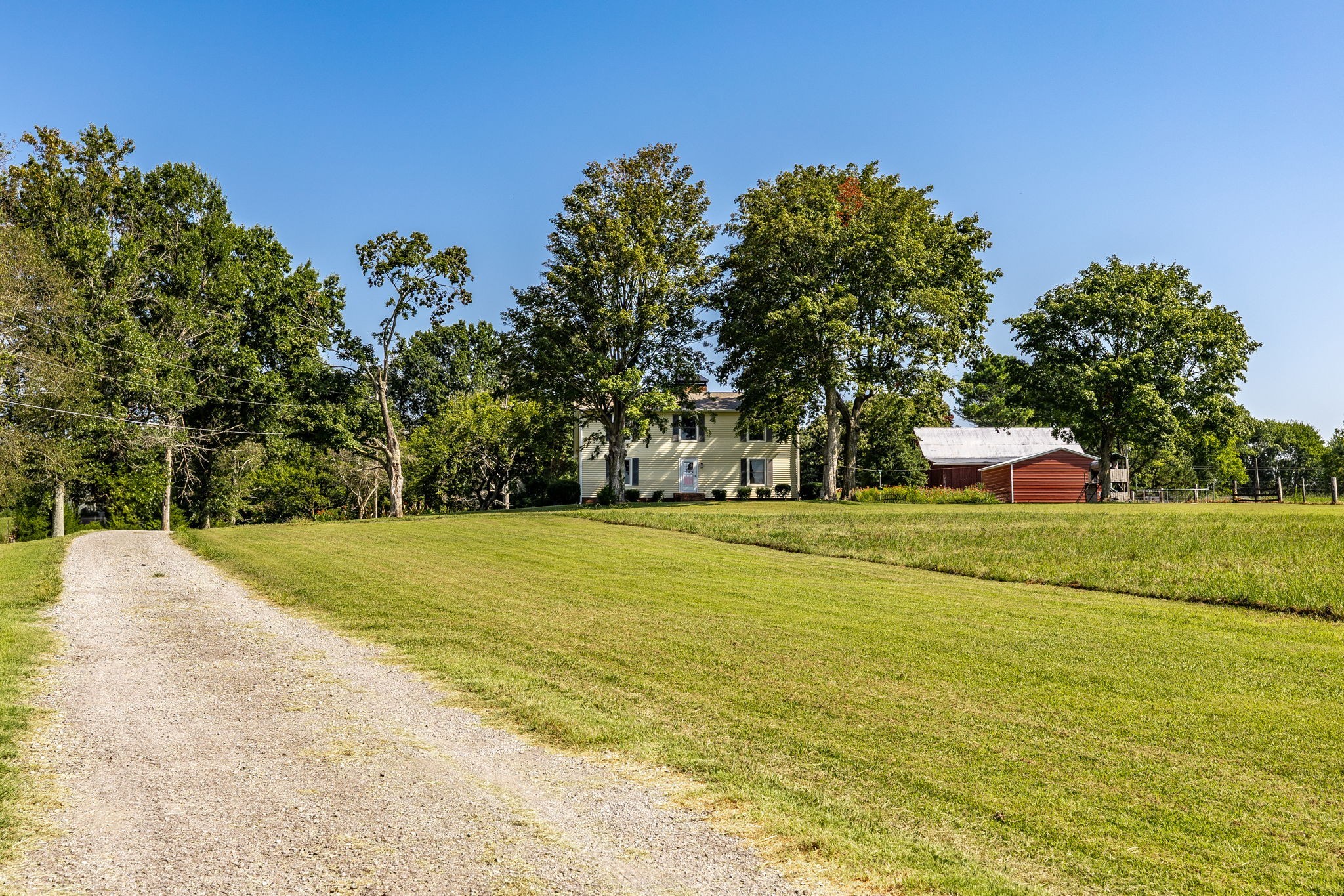 475 Fowler Ford Road Portland, TN 37148 - Photo 28 of 100 a front view of a house with a yard and trees