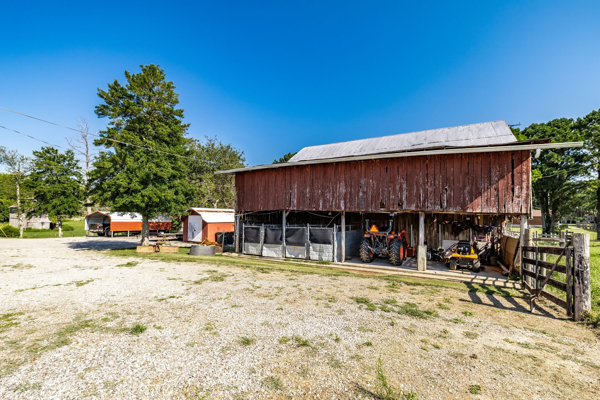 475 Fowler Ford Road Portland, TN 37148 - Photo 32 of 100 a view of a house with a patio and a yard