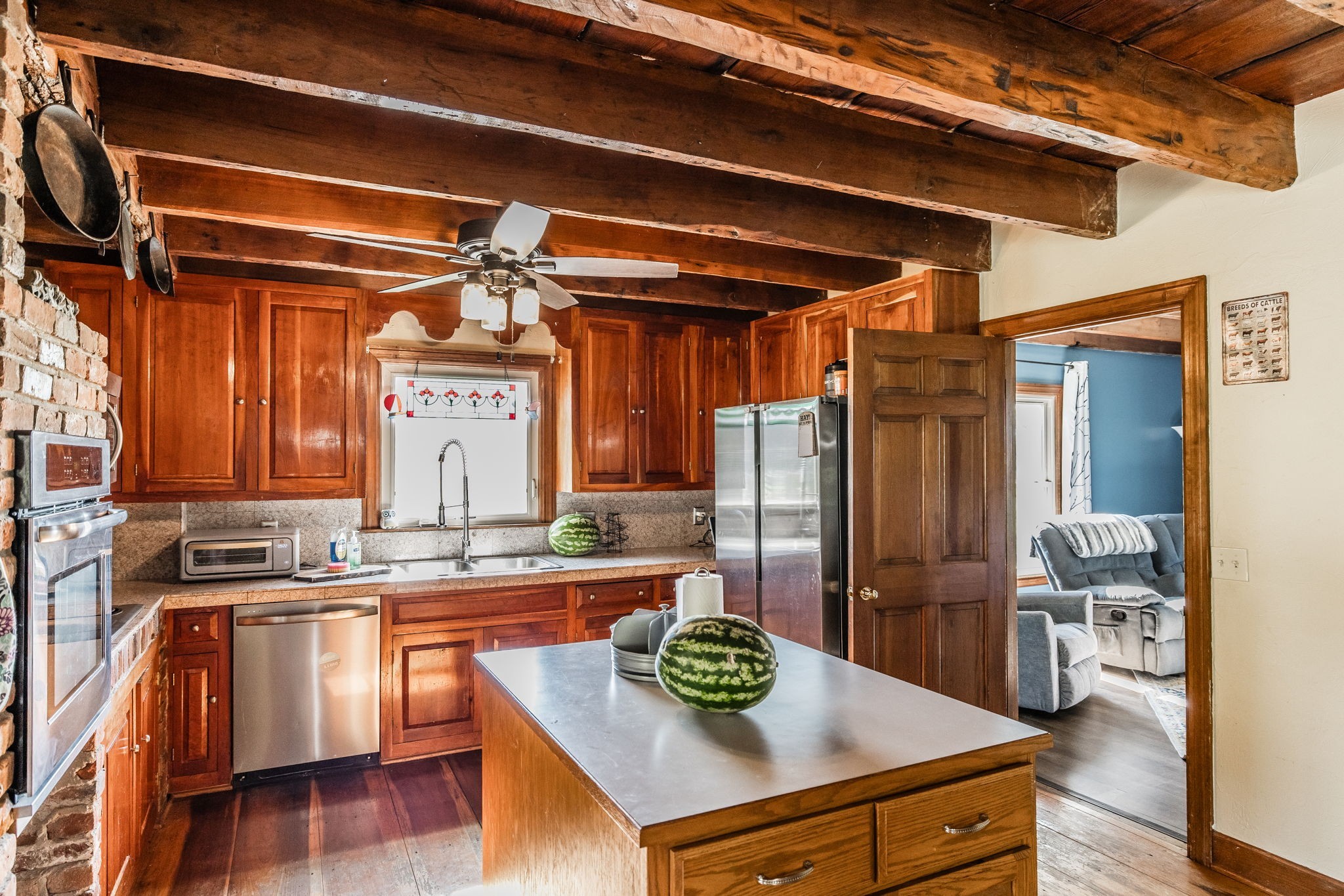 475 Fowler Ford Road Portland, TN 37148 - Photo 68 of 100 a kitchen with stainless steel appliances granite countertop a sink a stove and wooden cabinets