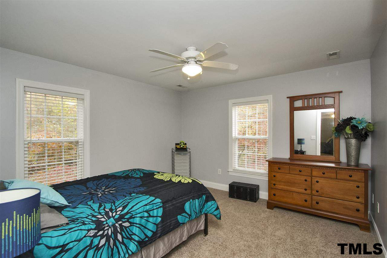 2012 Waterbrook Court Raleigh, NC 27603 - Photo 11 of 25 This bedroom has a private full bathroom attached, a walk-in closet, and a ceiling fan! Bedroom