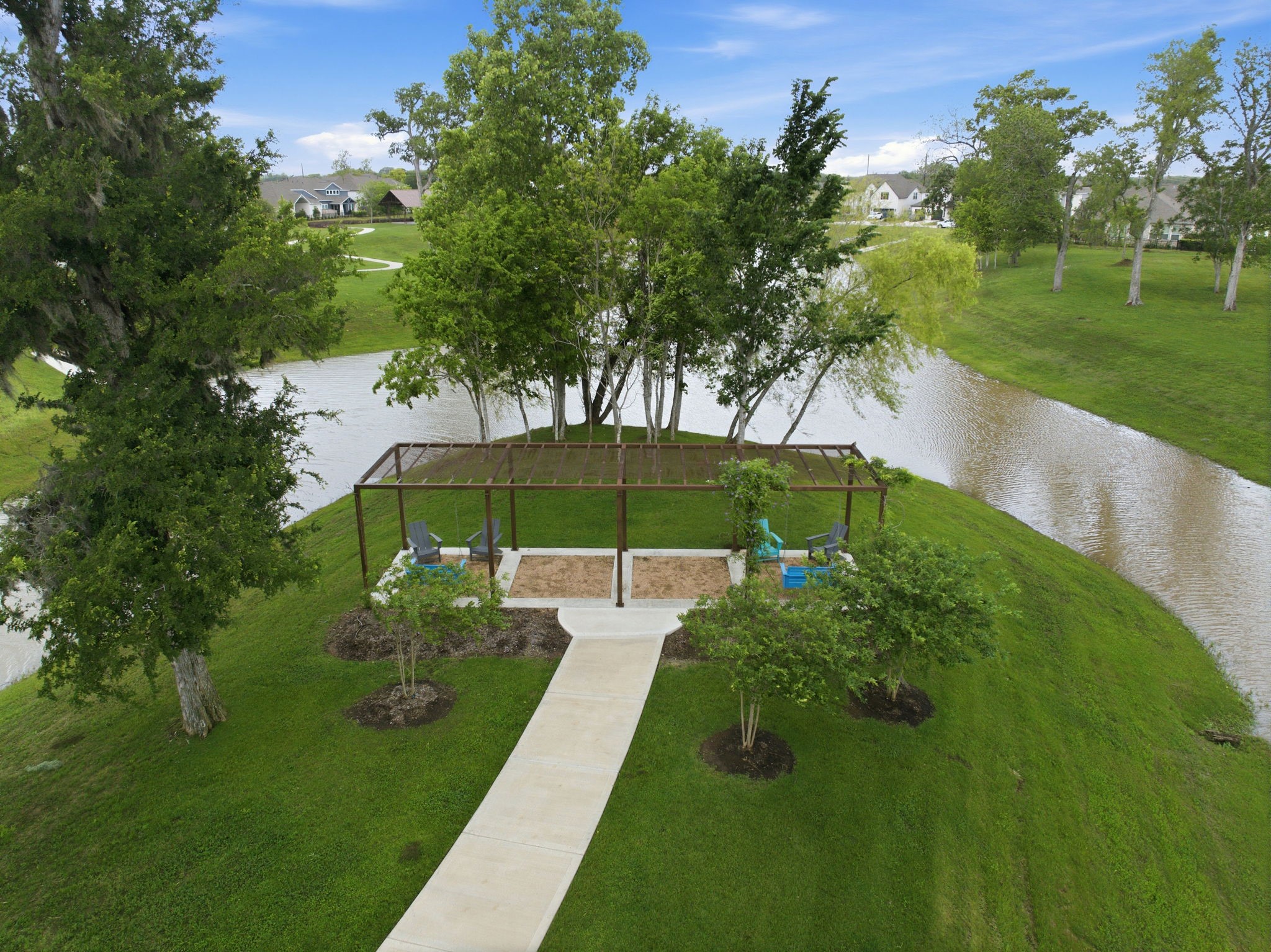 32503 Vly Redstem Way Fulshear, TX 77441 - Photo 10 of 18 a view of a garden with a bench