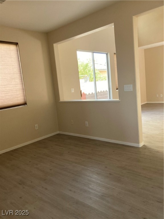 Undisclosed Address Las Vegas, NV 89128 - Photo 11 of 21 Empty room with wood finished floors and baseboard