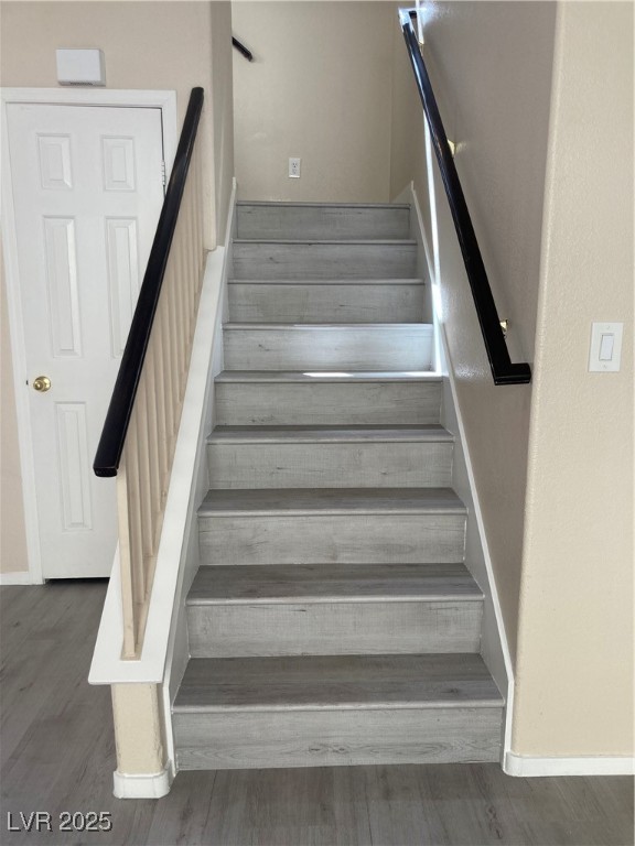 Undisclosed Address Las Vegas, NV 89128 - Photo 12 of 21 Stairway featuring wood finished floors and basebo