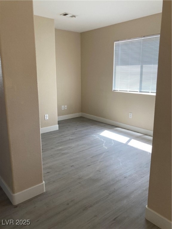 Undisclosed Address Las Vegas, NV 89128 - Photo 13 of 21 Empty room featuring baseboards and wood finished