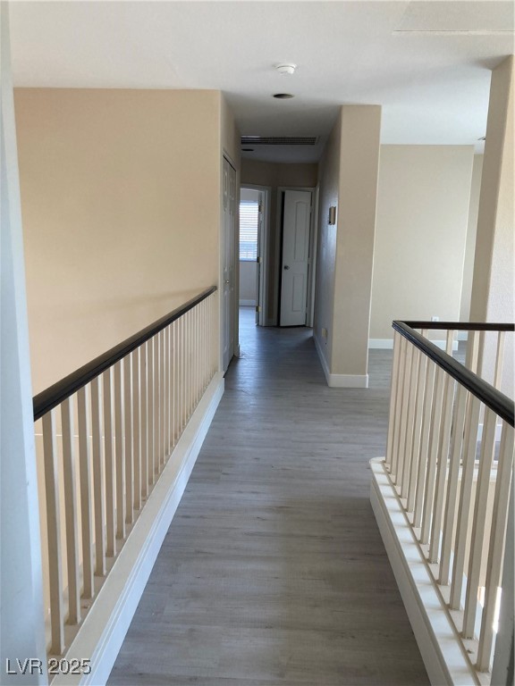 Undisclosed Address Las Vegas, NV 89128 - Photo 14 of 21 Hallway with baseboards, wood finished floors, and