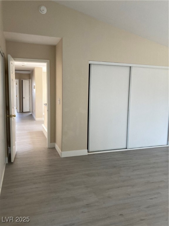 Undisclosed Address Las Vegas, NV 89128 - Photo 16 of 21 Hall featuring wood finished floors, vaulted ceili