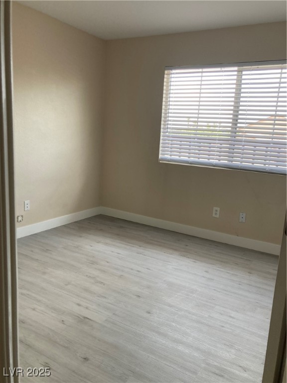 Undisclosed Address Las Vegas, NV 89128 - Photo 17 of 21 Unfurnished room with baseboards and wood finished