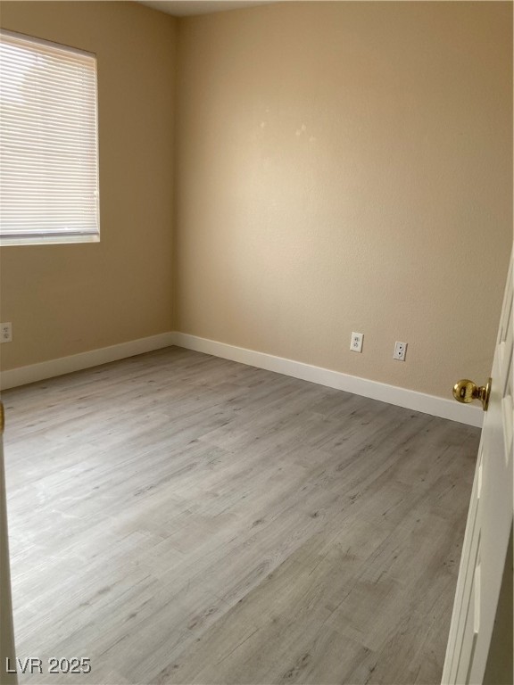 Undisclosed Address Las Vegas, NV 89128 - Photo 18 of 21 Empty room featuring wood finished floors and base