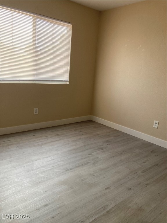 Undisclosed Address Las Vegas, NV 89128 - Photo 19 of 21 Empty room with wood finished floors and baseboard