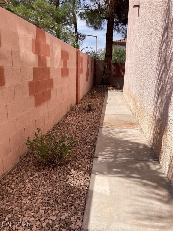 Undisclosed Address Las Vegas, NV 89128 - Photo 21 of 21 Fenced backyard with a patio area