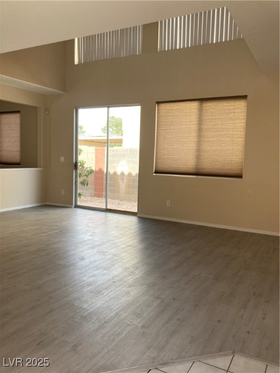 Undisclosed Address Las Vegas, NV 89128 - Photo 8 of 21 Unfurnished room with wood finished floors, a high