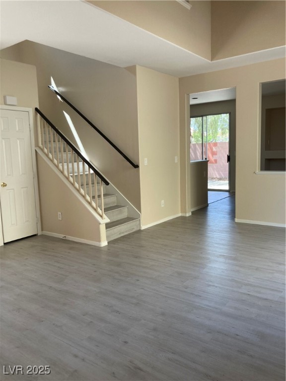 Undisclosed Address Las Vegas, NV 89128 - Photo 9 of 21 Unfurnished living room with wood finished floors,