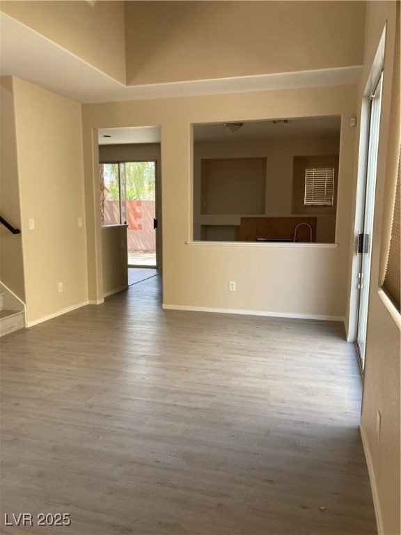 Undisclosed Address Las Vegas, NV 89128 - Photo 10 of 21 Unfurnished room with wood finished floors, basebo