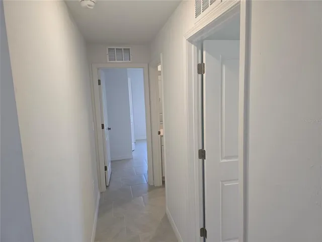 a view of a bathroom from the hallway