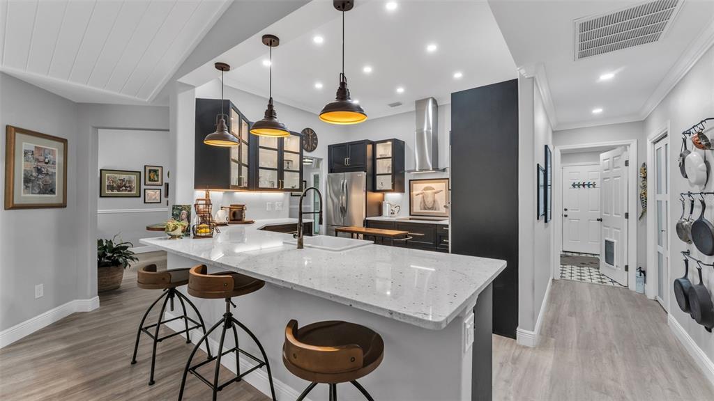 422 Mc Cormick Road Apopka, FL 32703 - Photo 20 of 95 a kitchen with stainless steel appliances granite countertop a sink a stove and a refrigerator
