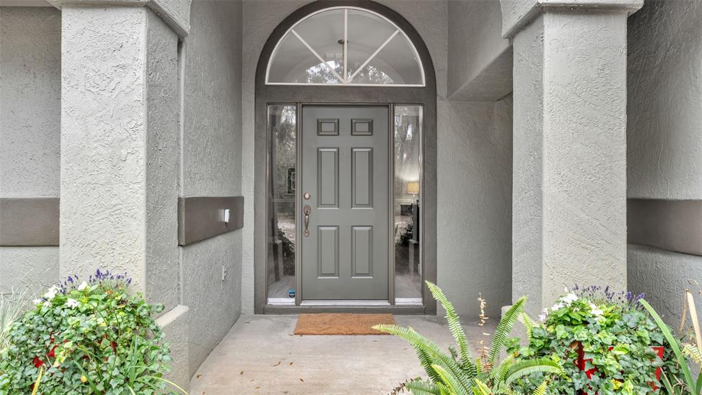 422 Mc Cormick Road Apopka, FL 32703 - Photo 2 of 95 a front view of a house with a garden