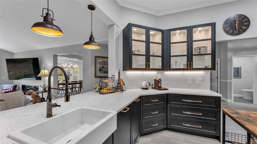 422 Mc Cormick Road Apopka, FL 32703 - Photo 21 of 95 a kitchen with a sink a stove and a chandelier