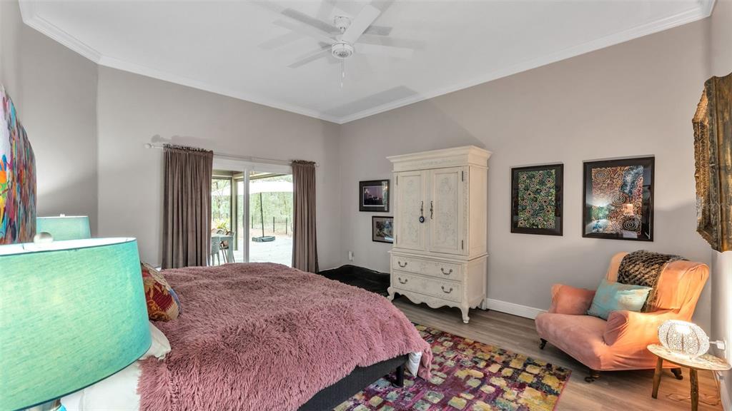 422 Mc Cormick Road Apopka, FL 32703 - Photo 24 of 95 a spacious bedroom with a bed and a dresser