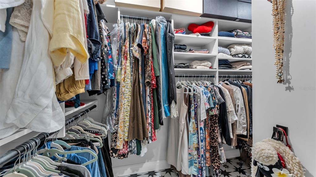 422 Mc Cormick Road Apopka, FL 32703 - Photo 29 of 95 a view of walk in closet with clothes and shoes